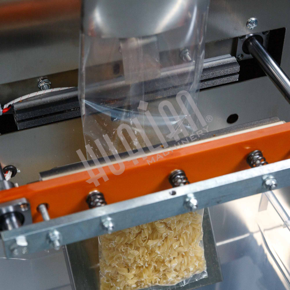 Автоматическая фасовочно-упаковочная машина DXDK-1000 NEW (пакет подушка, ширина пленки 300 мм, фотодатчик) Hualian - Купить с доставкой по всей России - 13