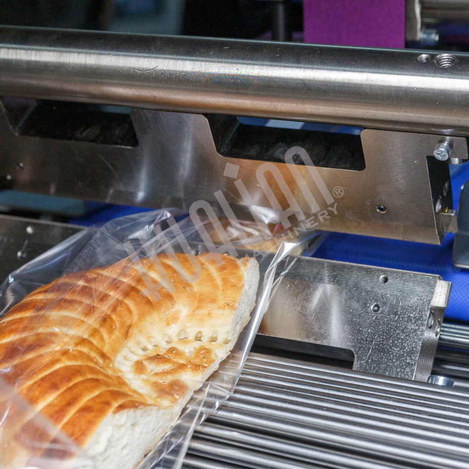 Горизонтальная упаковочная машина DXDZ-600XD (лент. 250 мм, рег.форм., S 400, L 180-500, H-120) Hualian - Купить с доставкой по всей России - 7