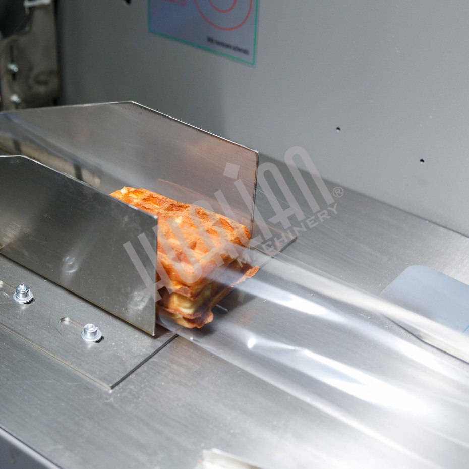 Горизонтальная упаковочная машина DXDZ-250XD (лент.100 мм, рег. форм., S 250, L 120-280, H 60) Hualian - Купить с доставкой по всей России - 8