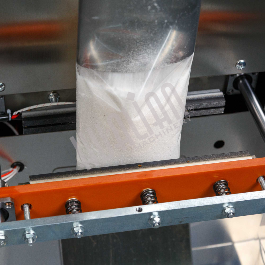 Автоматическая фасовочно-упаковочная машина DXDK-1000 NEW (пакет подушка, ширина пленки 300 мм, фотодатчик) Hualian - Купить с доставкой по всей России - 5