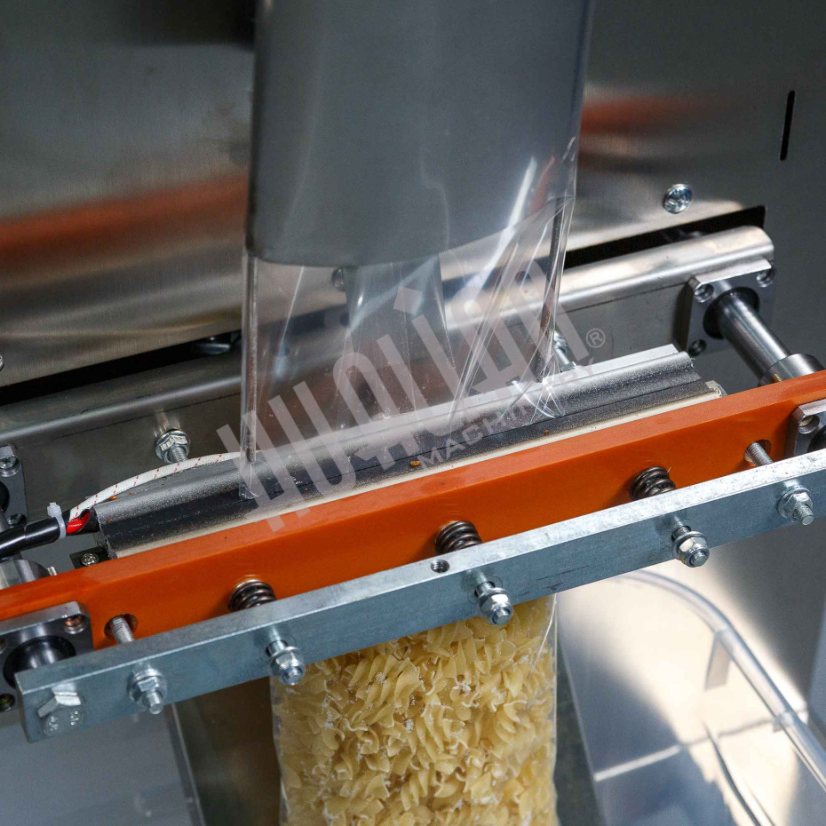 Автоматическая фасовочно-упаковочная машина DXDK-1000 NEW (пакет подушка, ширина пленки 300 мм, фотодатчик) Hualian - Купить с доставкой по всей России - 10