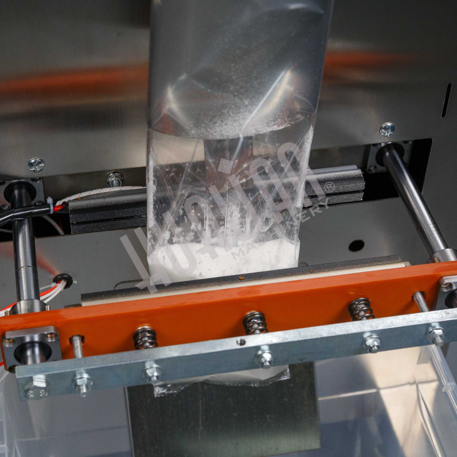 Автоматическая фасовочно-упаковочная машина DXDK-1000 NEW (пакет подушка, ширина пленки 300 мм, фотодатчик) Hualian - Купить с доставкой по всей России - 6