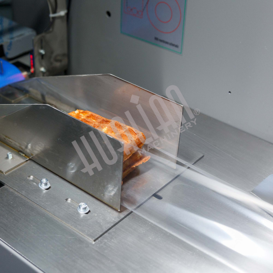 Горизонтальная упаковочная машина DXDZ-250XD (лент. 60 мм, рег. форм., S 250, L 120-280, H 60) Hualian - Купить с доставкой по всей России - 11