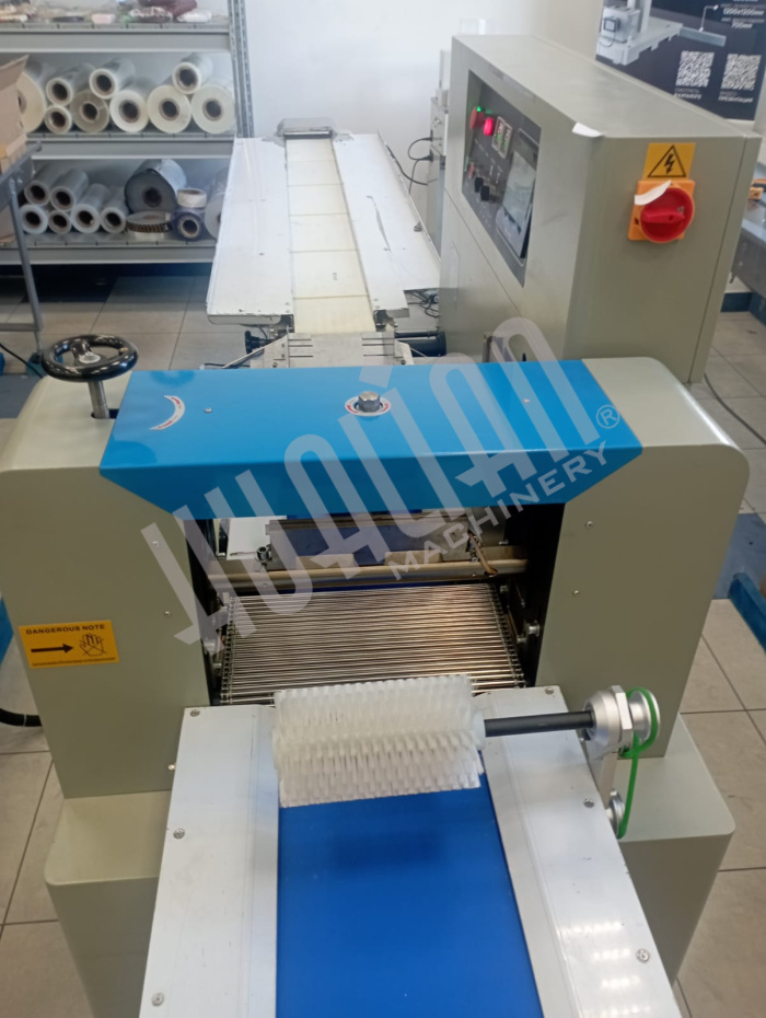 Горизонтальная упаковочная машина DXDZ-450XD NEW (лент. 200, рег. форм., S 400mm, L 130-450, H 80) (Выставочный образец) Hualian - Купить с доставкой по всей России - 5